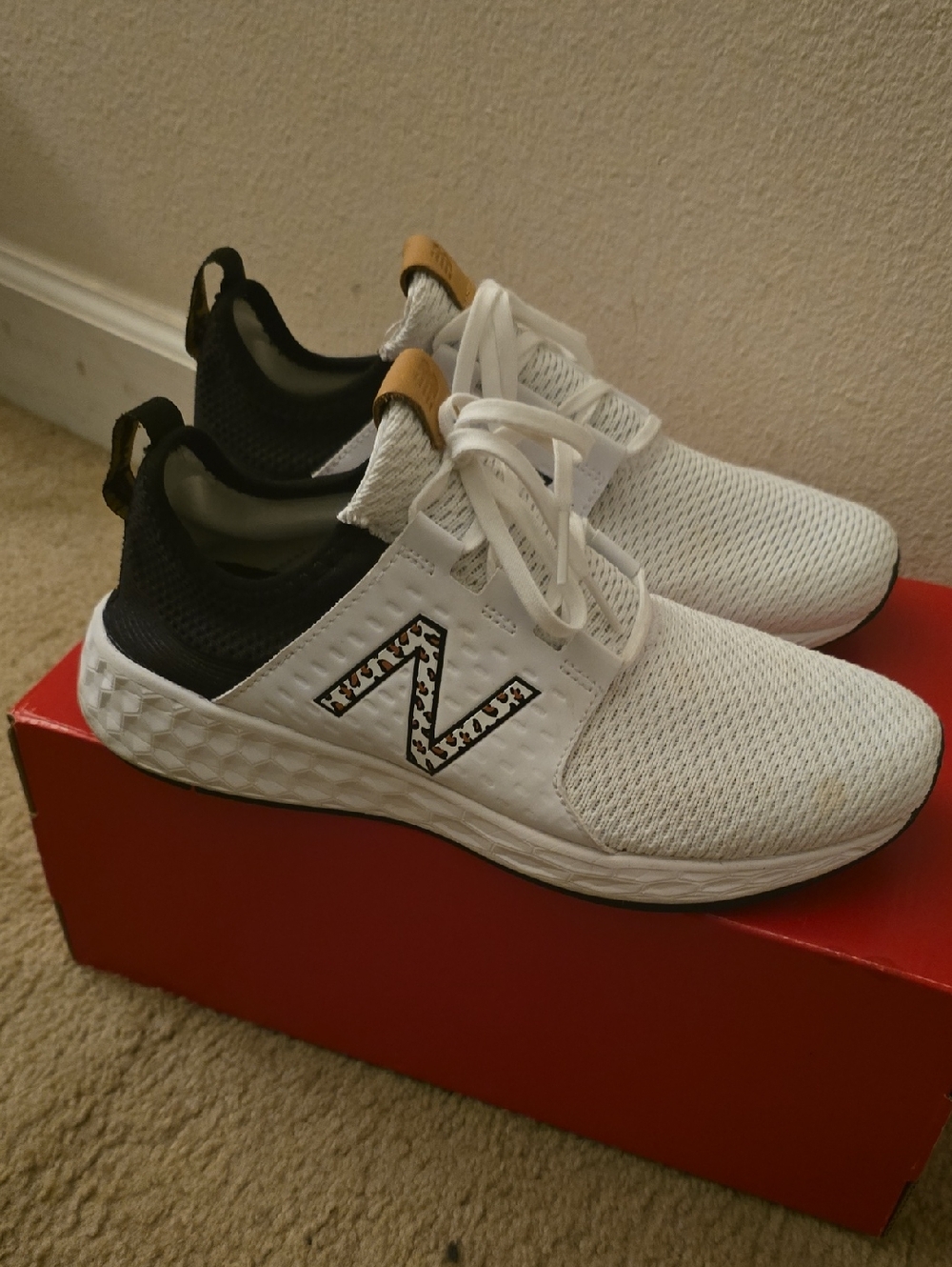 New Balance White Athletic Sneakers with Black Collar and Tan Pull Tabs